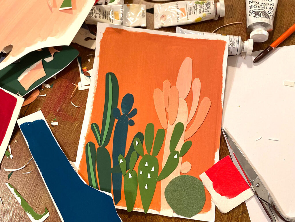 Paper cacti scene with art supplies